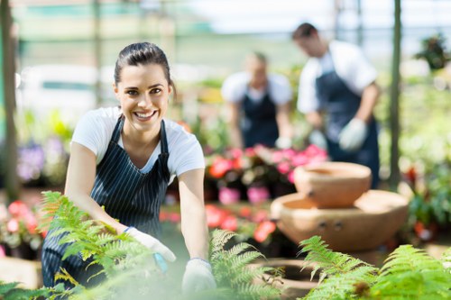 Worker wearing PPE while handling garden chemicals